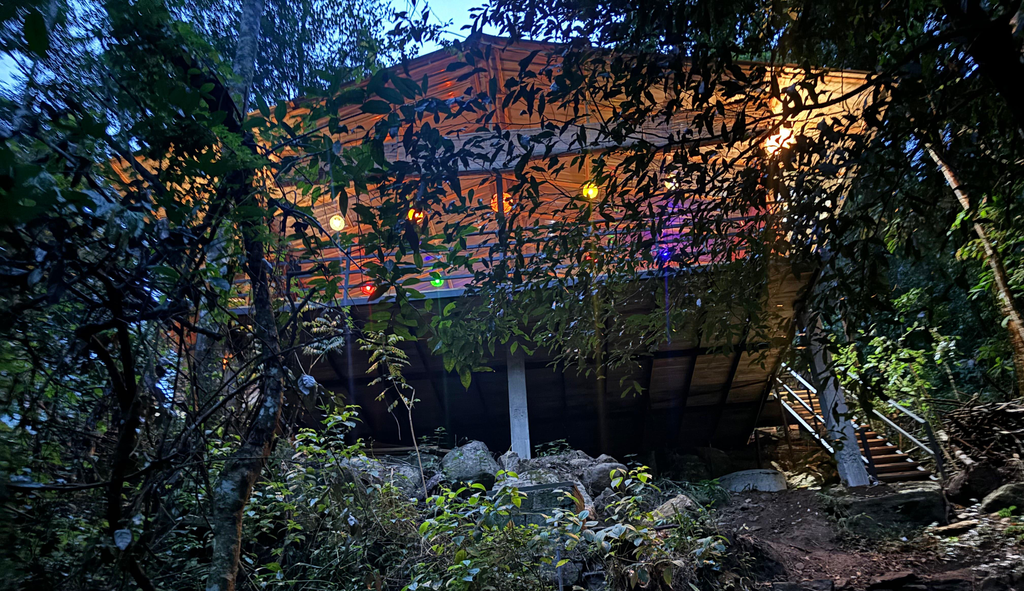 Riverfront dining deck with wooden tables